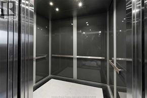 Windsor condo for rent - A glass elevator with the word REALTOR on the side.
