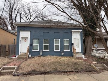Louisville apartment for rent - A blue house with a white door and windows.