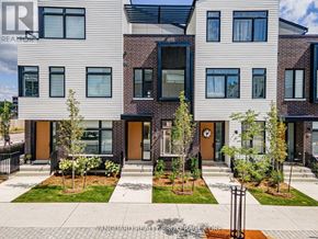 Mississauga (Port Credit) townhouse for rent - A building with a sign that says Vanguard Realty Brokerage Corp.