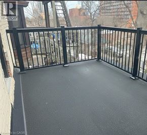 Hamilton apartment for rent - A bathroom with a toilet and a washing machine in it.