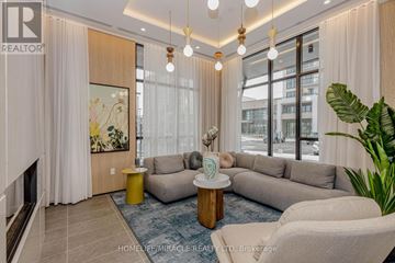 Milton (Cb Cobban) condo for rent - A living room with a grey sofa, a yellow side table, and a painting on the wall.