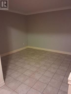 Niagara Falls (Downtown) apartment for rent - A room with a tile floor and a wall with a logo that says REALTOR.