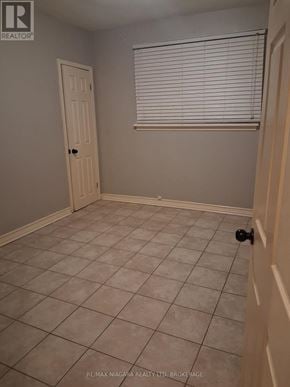 Niagara Falls (Downtown) apartment for rent - A room with a door and a window with blinds.