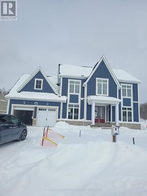 Oro-Medonte apartment for rent - A blue house with a car parked in front of it.