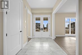 Oro-Medonte apartment for rent - A spacious hallway with a tiled floor and white doors.