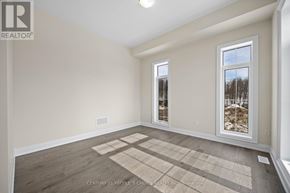 Oro-Medonte apartment for rent - A room with a large window and a wooden floor.