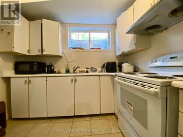 Mississauga (Erin Mills) apartment for rent - A kitchen with white cabinets and appliances.