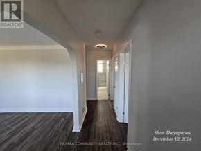 Niagara Falls (West Wood) apartment for rent - A hallway with wood flooring and white walls.