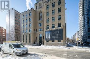 Ottawa apartment for rent - A white van is parked in front of a building with a sign that says MET on it.