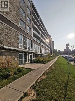 Waterloo condo for rent - A building with a sign that says "REALTOR" on it.