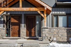 Blue Mountains townhouse for rent - A house with a wooden front porch and two brown doors.