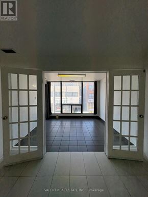 Toronto (South Riverdale) apartment for rent - A hallway with a sign that says "REALTOR" on the wall.