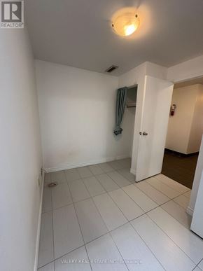 Toronto (South Riverdale) apartment for rent - A white room with a doorway leading to another room.