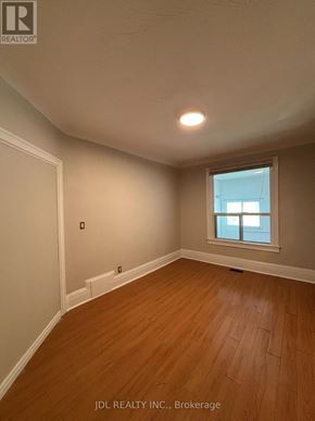 Toronto (University) apartment for rent - A room with wooden flooring and a window.