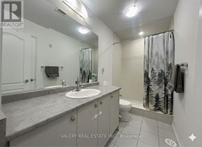Haldimand townhouse for rent - A bathroom with a sink, toilet, and shower.