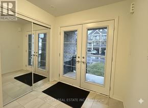 Haldimand townhouse for rent - A room with a glass door leading to a balcony.