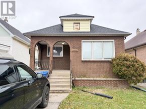 Windsor apartment for rent - A house with a car parked in front.
