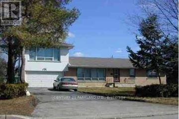 Toronto (L'amoreaux) apartment for rent - A house with a car parked in front and a sign that says Century 21 Parlayland Ltd. Brokerage.