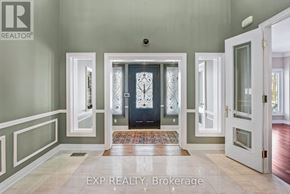 Newmarket (Stonehaven-Wyndham) apartment for rent - A foyer with a dark wood floor and a black door.