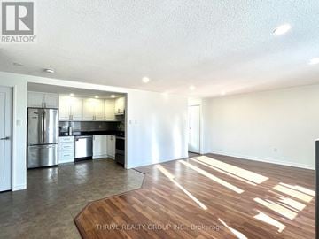 London South (South B) multi-family for rent - A kitchen with white cabinets and stainless steel appliances is shown.