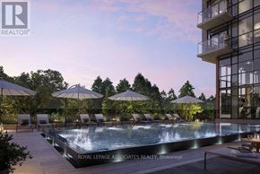 Toronto (Centennial Scarborough) condo for rent - A pool surrounded by lounge chairs and umbrellas in front of a building.