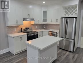 Hamilton (Crown Point) apartment for rent - A modern kitchen with white cabinets and stainless steel appliances.