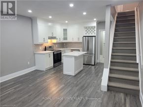 Hamilton (Crown Point) apartment for rent - A modern kitchen with a staircase leading to the upper floor.