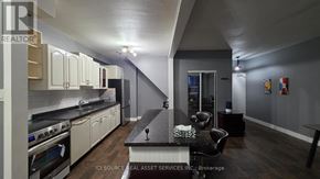 Hamilton (Vincent) townhouse for rent - A street sign for Nicklaus Drive is illuminated at night.