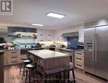 Niagara Falls (Chippawa) apartment for rent - A modern kitchen with stainless steel appliances and wooden cabinets.