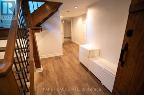 Richmond Hill (Crosby) apartment for rent - A wooden staircase with a black metal railing.