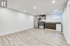 Newmarket (Bristol-London) apartment for rent - A spacious kitchen with wooden flooring and modern appliances.