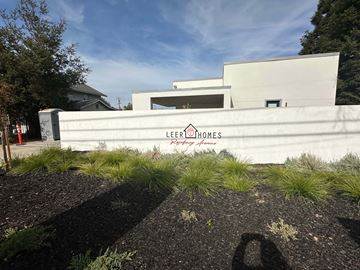 Modesto apartment for rent - A modern building with the name Lee Brathames Lee Brathames on the wall.