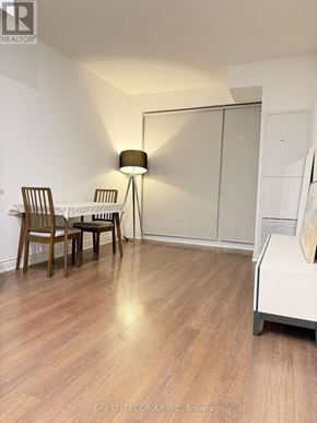 Markham (Unionville) condo for rent - A room with a table and chairs and a lamp.