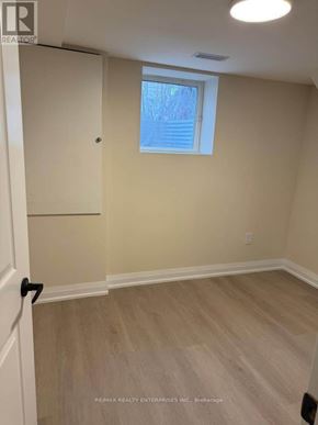 St. Catharines (Carlton/Bunting) duplex for rent - A room with a window and a door.