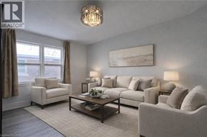 Kitchener apartment for rent - A living room with a large couch, a chair, and a coffee table.