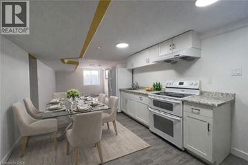 Kitchener apartment for rent - A well-lit kitchen and dining area with modern furniture.