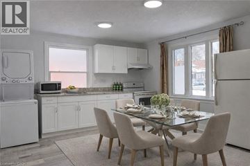 Kitchener apartment for rent - A modern kitchen with a dining table set for two.