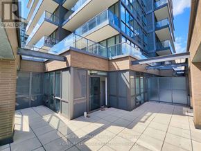Toronto (Henry Farm) condo for rent - A reception area with a white sofa and a wooden pillar.