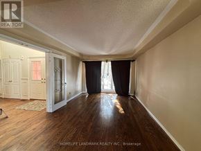 Aurora (Aurora Highlands) apartment for rent - A room with wooden floors and a large window with curtains.