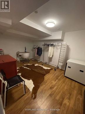 Markham (Unionville) apartment for rent - A room with a cowhide rug and a chair.