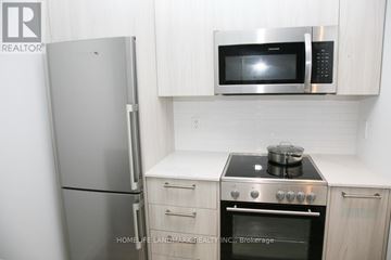 Toronto (Church-Yonge Corridor) condo for rent - A kitchen with a stove, oven, refrigerator and microwave.