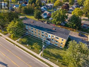 St. Thomas condo for rent - A large building with a parking lot in front of it.