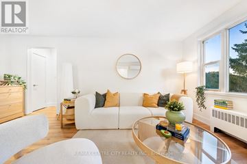 St. Thomas condo for rent - A living room with a white couch and a glass coffee table.