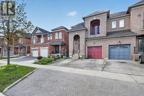 Vaughan (East Woodbridge) apartment for rent - A house with a red garage door is for sale.