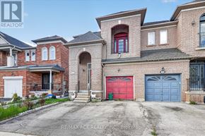 Vaughan (East Woodbridge) apartment for rent - A large brick house with a red garage door is for sale.