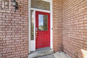 Vaughan (East Woodbridge) apartment for rent - A red door with a glass window above it.