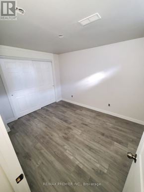 Orillia townhouse for rent - A room with a white door and a grey floor.