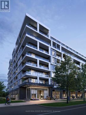Burlington (Lasalle) condo for rent - A modern apartment building with balconies and a glass entrance.