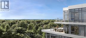 Burlington (Lasalle) condo for rent - A modern apartment building with a balcony overlooking a forested area.
