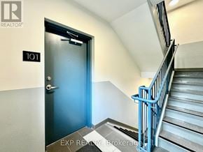 Ottawa apartment for rent - A blue door is at the end of a flight of stairs.